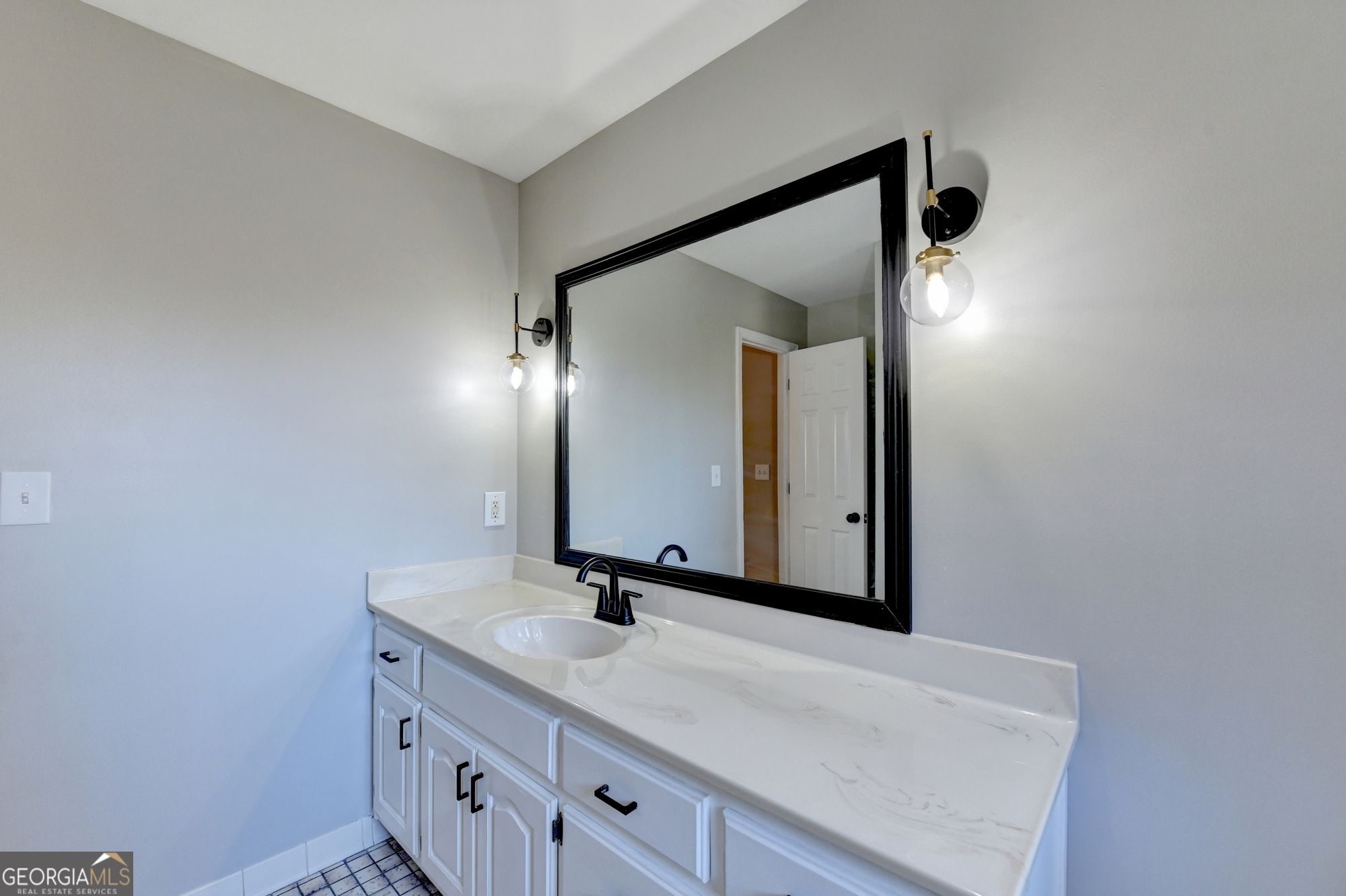590 Manning Gin Road Monroe, GA 30656 - Photo 58 of 82 a bathroom with a sink and a mirror