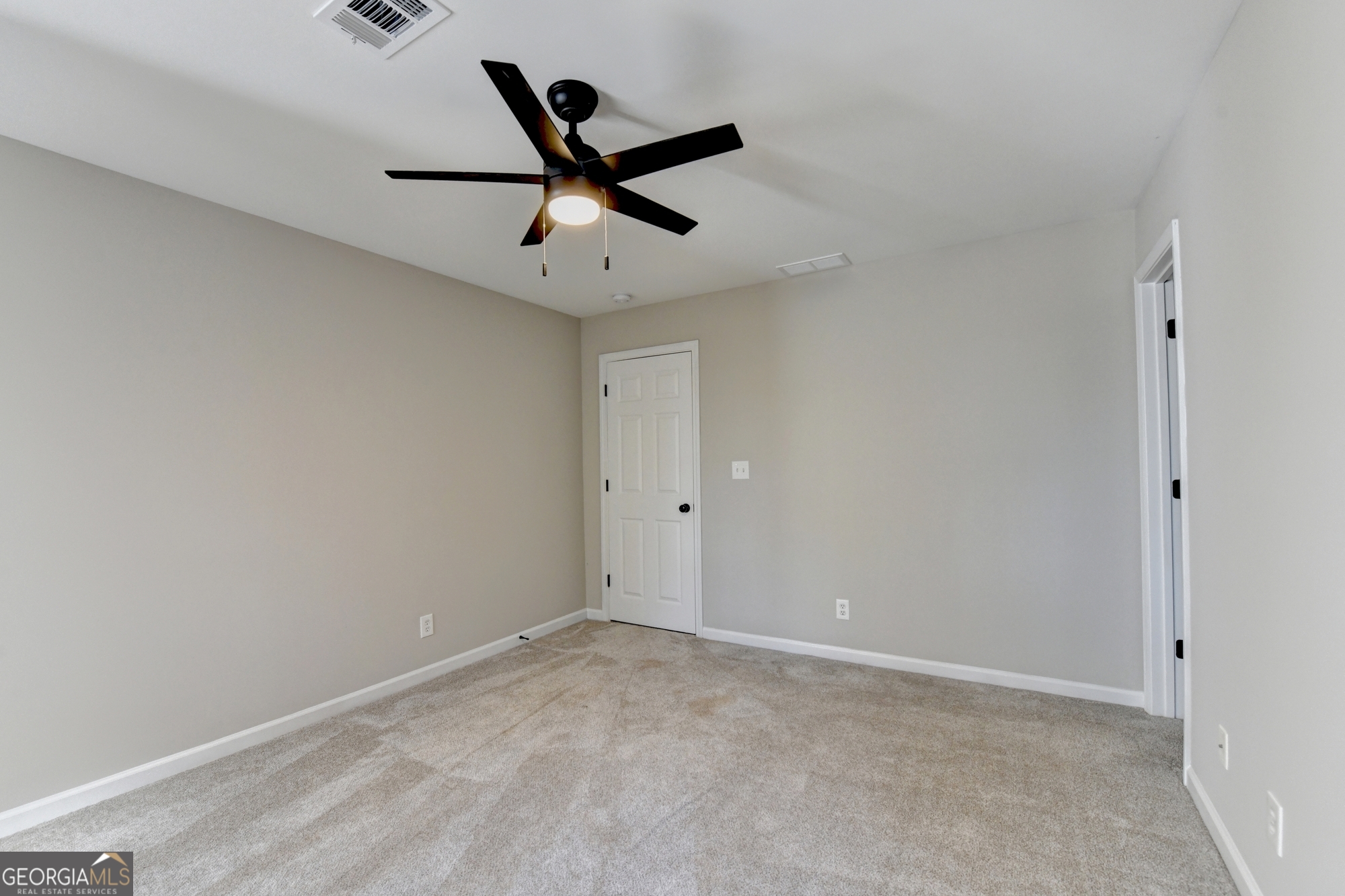 590 Manning Gin Road Monroe, GA 30656 - Photo 61 of 82 a view of a big room with wooden floor