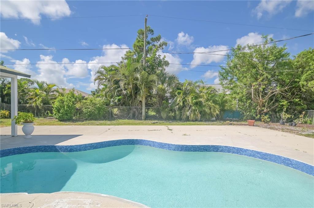 9104 Pineapple Road Fort Myers, FL 33967 - Photo 18 of 24 a view of a swimming pool and an outdoor space