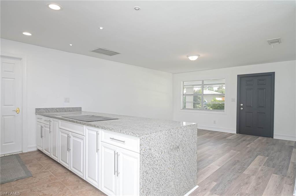 9104 Pineapple Road Fort Myers, FL 33967 - Photo 8 of 24 an empty room with wooden floor