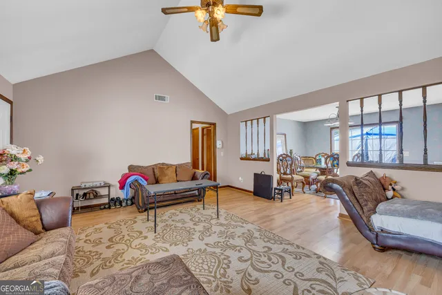 a view of a dining room with furniture wooden floor and a chandelier