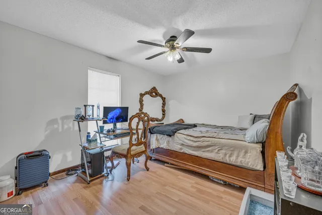 a kitchen that has a lot of cabinets a sink and appliances in it