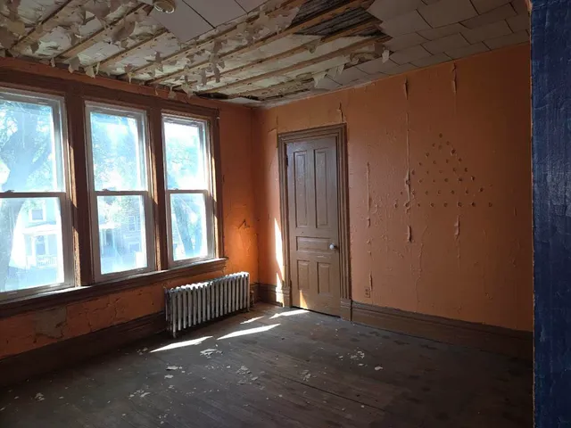 a view of an empty room with a window