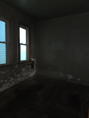a view of a door in an empty room