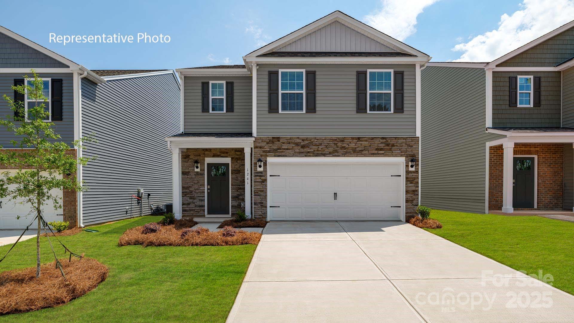 1023 Two Brothers Lane York, SC 29745 - Photo 1 of 30 a front view of a house with a yard and garage