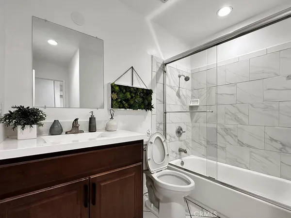 a view of a patio with a table and chairs