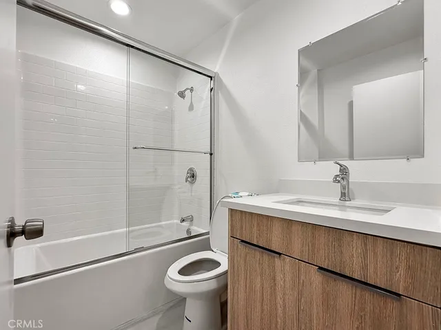 a kitchen with granite countertop a stove and a sink