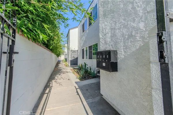 a view of kitchen with wooden floor and electronic appliances