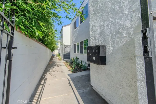 a view of kitchen with wooden floor and electronic appliances