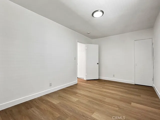 a bathroom with a toilet a sink a mirror and shower