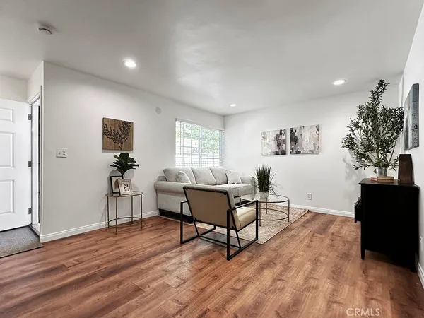 a living room with furniture or couch and a large window