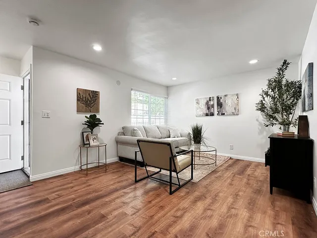 a living room with furniture or couch and a large window