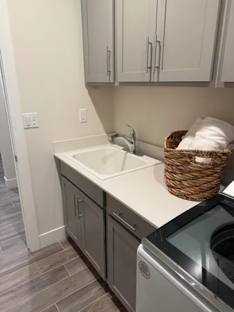a kitchen with a sink and cabinets