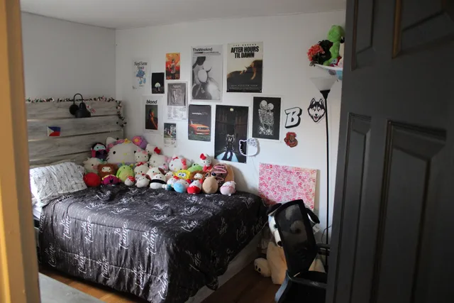 a bed room with a bed and a window