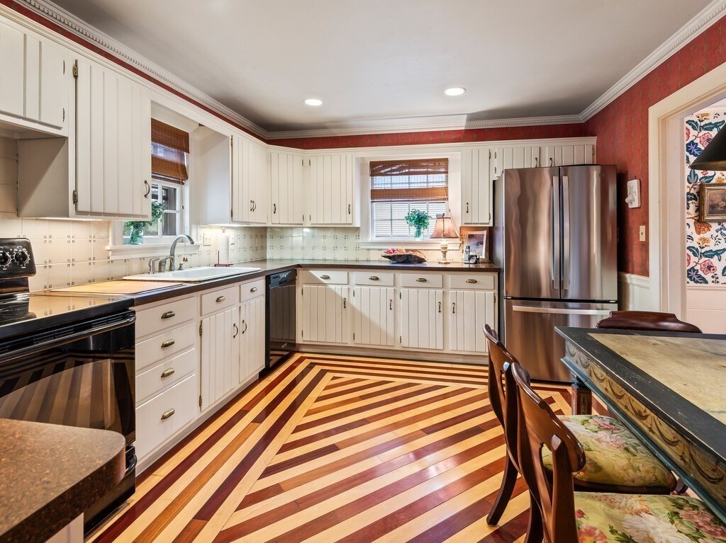20 Manhattan Road Worcester, MA 01602 - Photo 13 of 41 a kitchen with stainless steel appliances granite countertop a sink stove and refrigerator