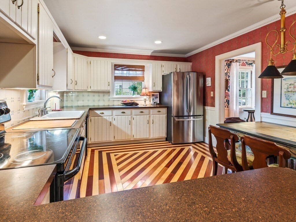 20 Manhattan Road Worcester, MA 01602 - Photo 14 of 41 a kitchen with stainless steel appliances granite countertop a refrigerator a sink a stove and white cabinets