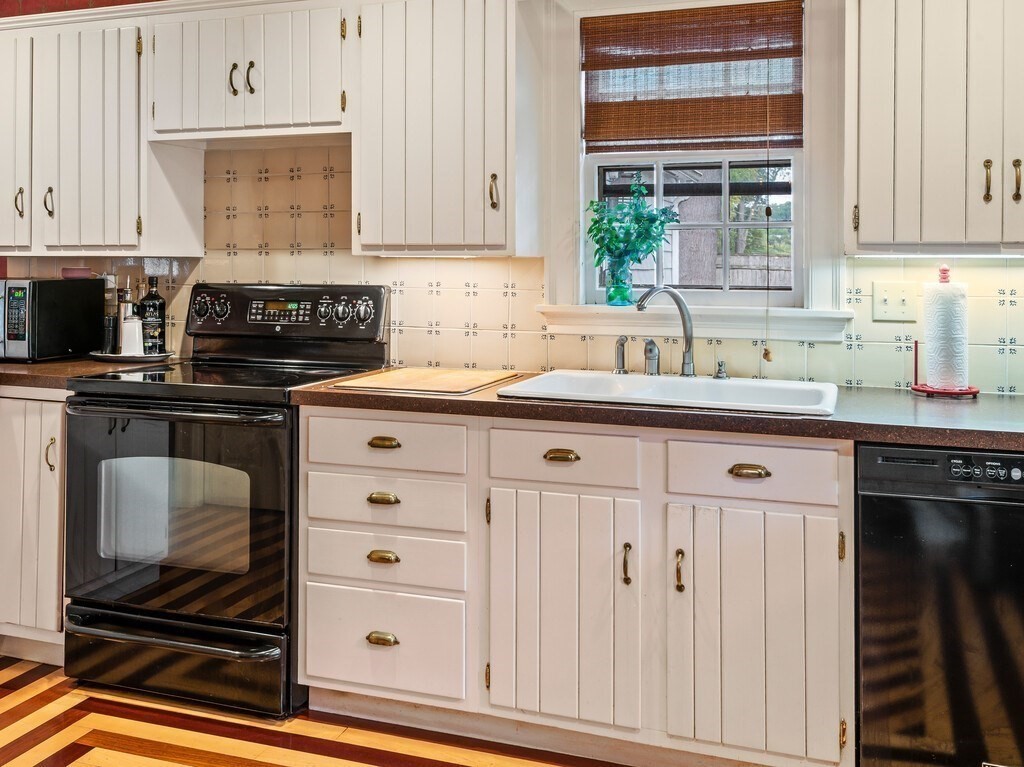 20 Manhattan Road Worcester, MA 01602 - Photo 15 of 41 a kitchen with stainless steel appliances white cabinets and a sink