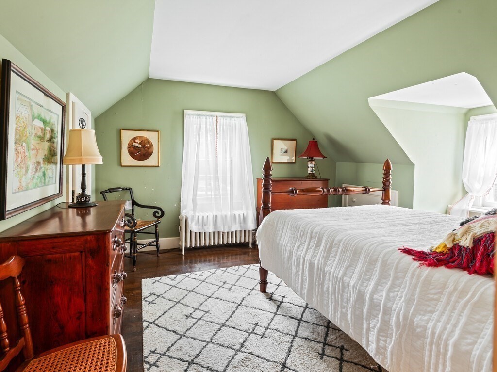 20 Manhattan Road Worcester, MA 01602 - Photo 23 of 41 a bedroom with a bed and wooden floor