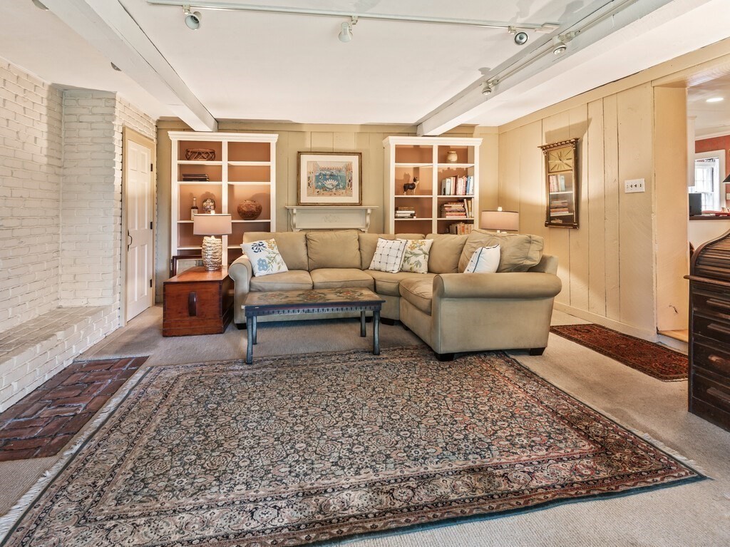 20 Manhattan Road Worcester, MA 01602 - Photo 28 of 41 a living room with furniture and a rug
