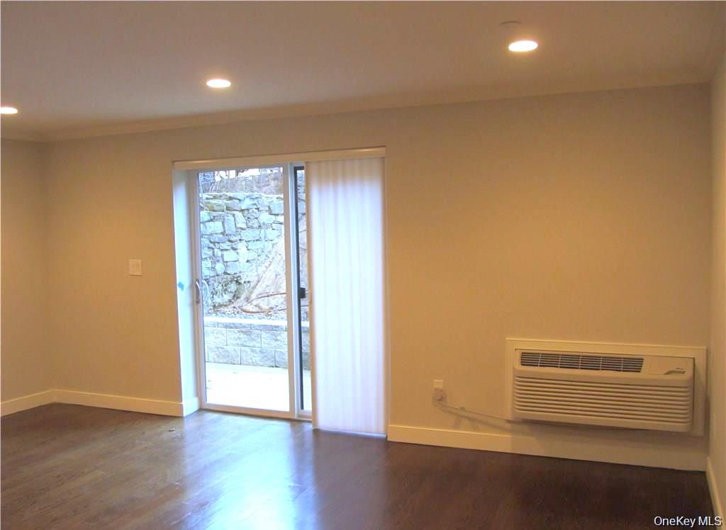 17 Cedar Street, Unit 3 Dobbs Ferry, NY 10522 - Photo 3 of 7 an empty room with wooden floor and windows