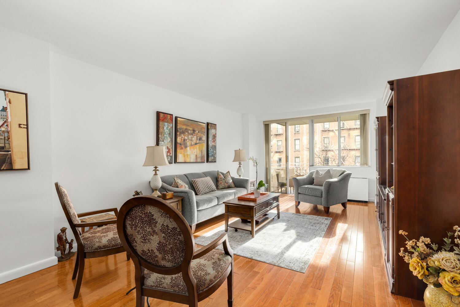 515 East 79th Street, Unit 4E Manhattan, NY 10075 - Photo 2 of 10 a living room with furniture and wooden floor