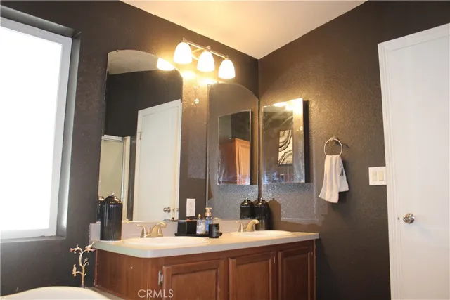 a bedroom with a bed and cabinets