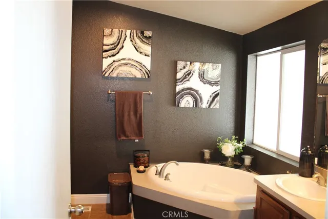 a kitchen with stainless steel appliances granite countertop a refrigerator and a stove