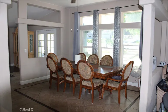 a view of a room with gym equipment and a large window