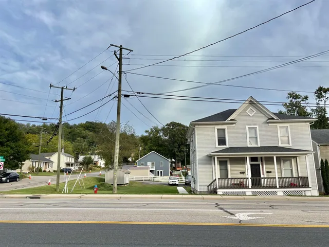 a view of a big building next to a road