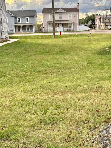 a front view of residential houses with outdoor space and swimming pool