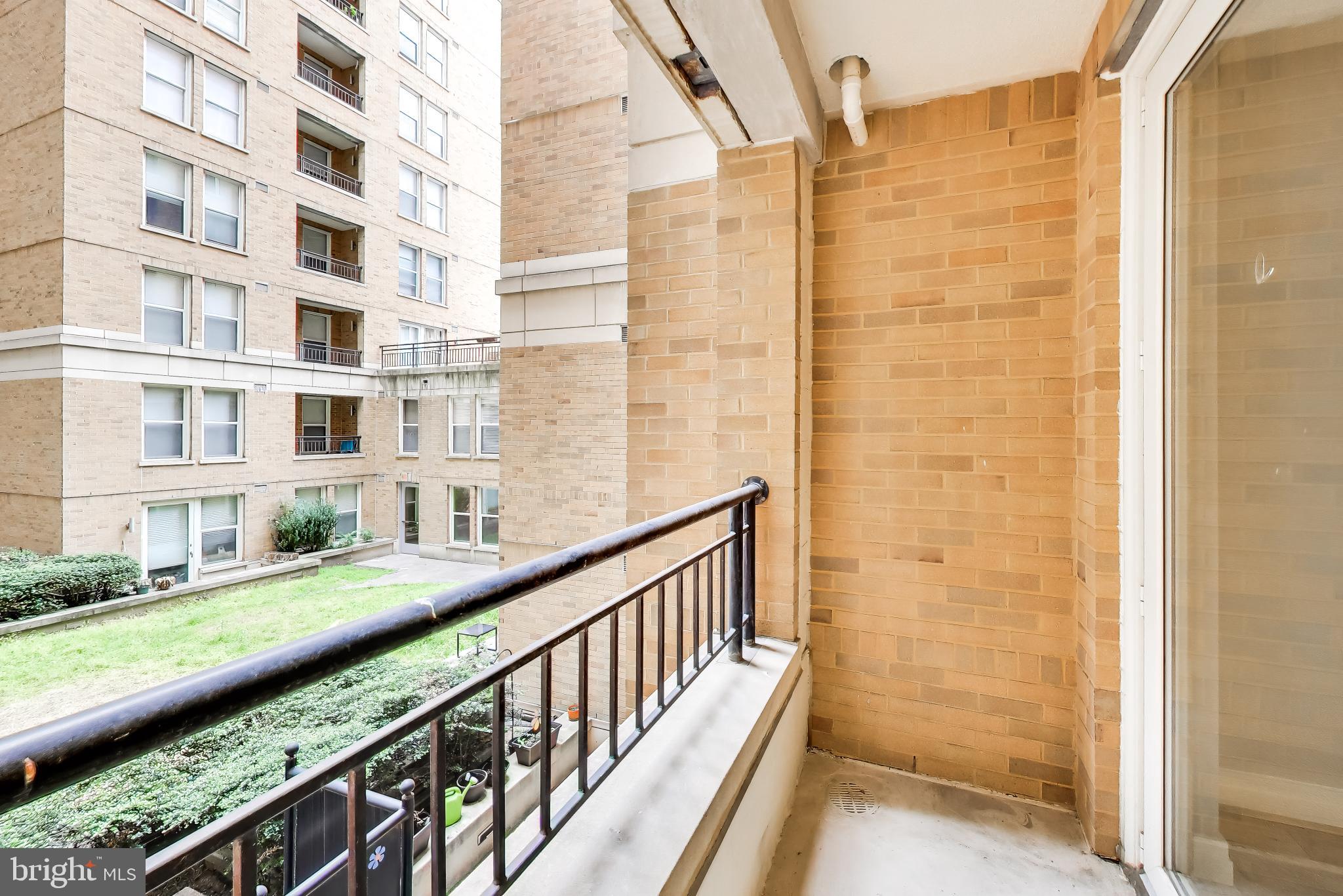 915 E Street Northwest, Unit 414 Washington, DC 20004 - Photo 20 of 35 a view of a balcony with chairs