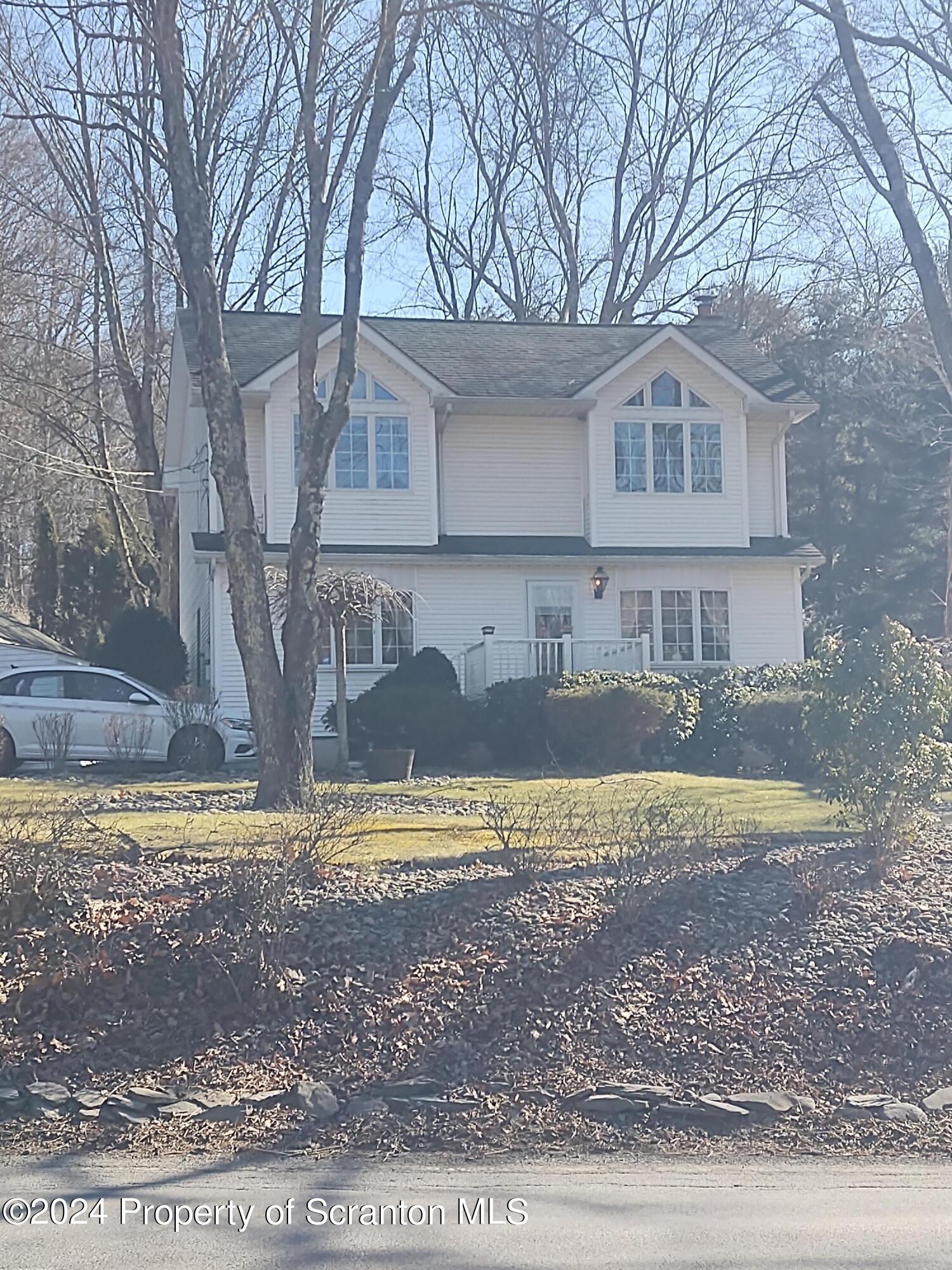 2401 Chase Road Shavertown, PA 18708 - Photo 8 of 19 a view of a house with a yard covered in snow