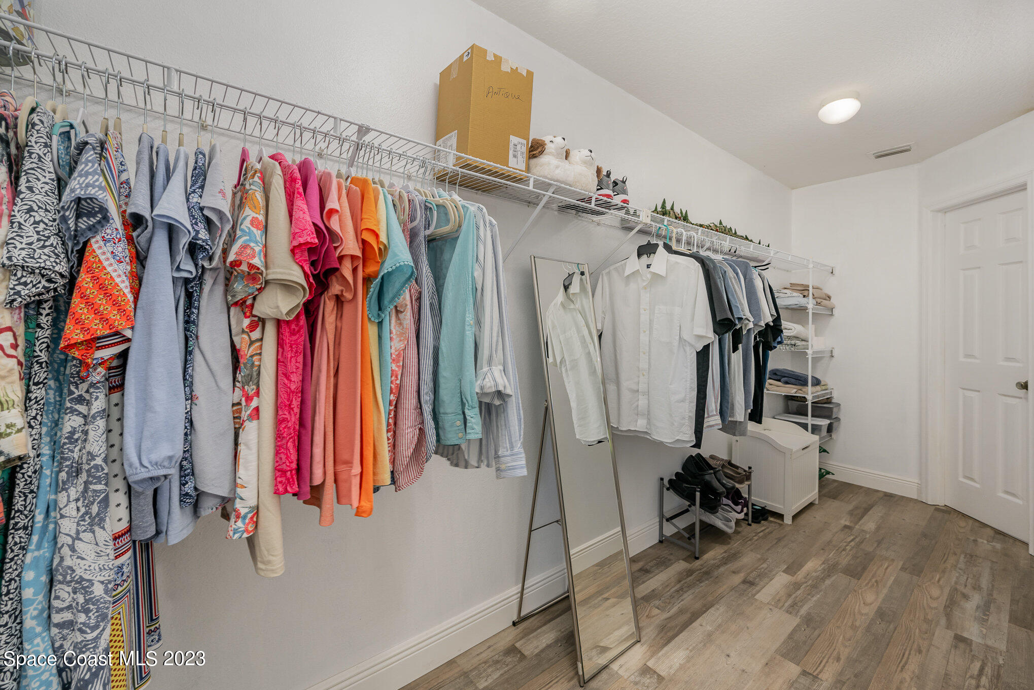 1780 Atz Road Malabar, FL 32950 - Photo 14 of 34 a view of walk in closet with clothes and shoes