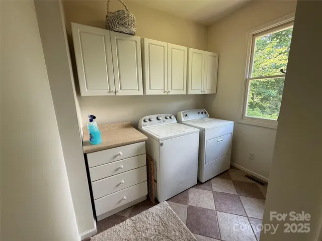 a utility room with closet dryer and washer