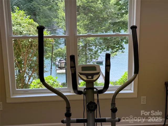 a view of a room with furniture and a window