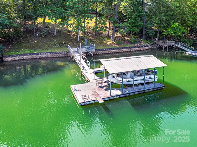 a view of a wooden deck with lake view