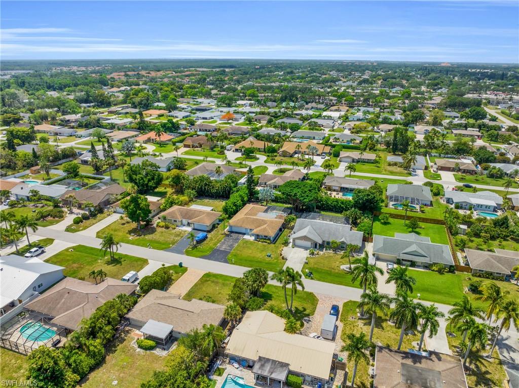 130 Mentor Drive Naples, FL 34110 - Photo 45 of 47 an aerial view of residential houses with outdoor space and trees