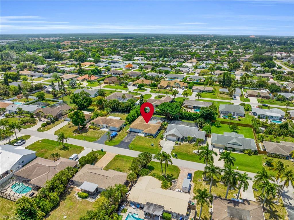 130 Mentor Drive Naples, FL 34110 - Photo 46 of 47 an aerial view of residential houses with outdoor space and trees all around