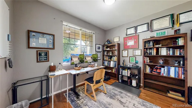 a work room with furniture and book shelf