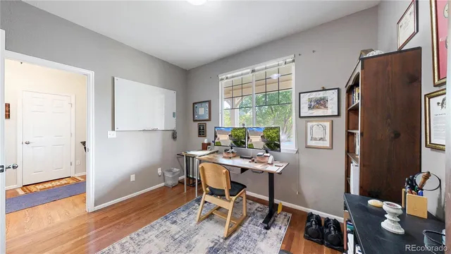 a workspace with furniture and window