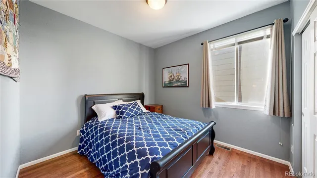 a bedroom with bed and window