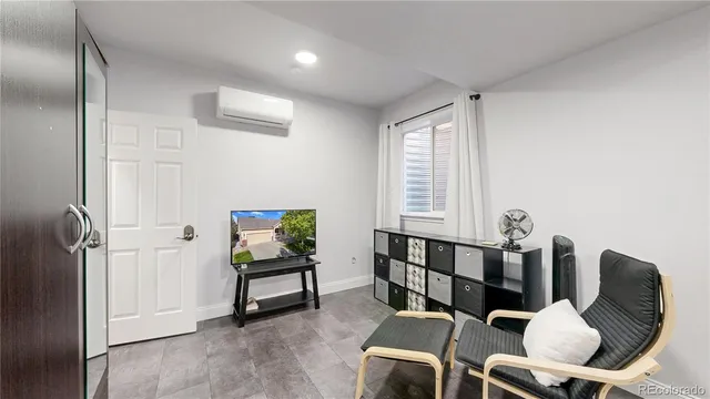 a view of a livingroom with furniture and windows