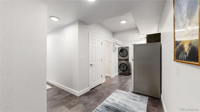 a view of a hallway with washer and dryer