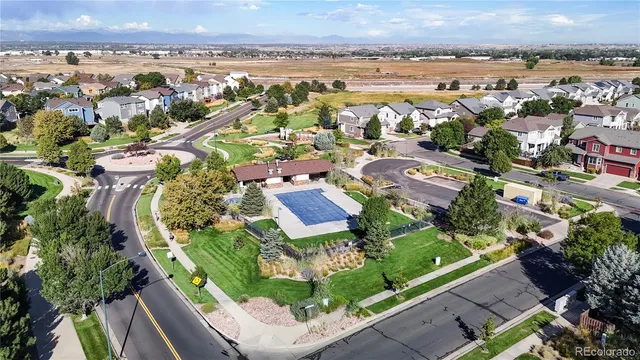 an aerial view of residential building and lake