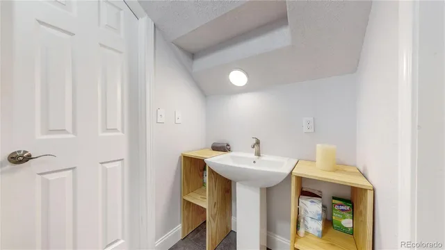 a bathroom with a sink and mirror