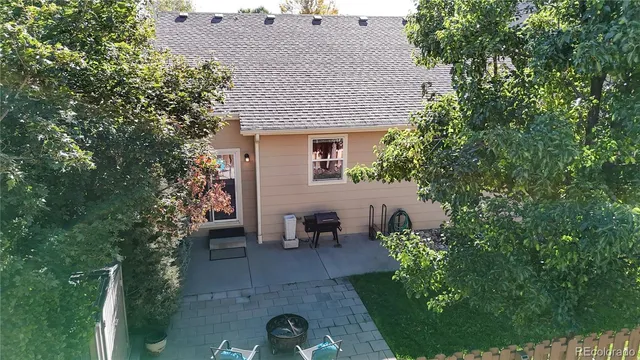 a view of a house with sitting area and garden