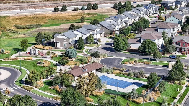 an aerial view of residential houses with outdoor space
