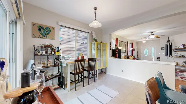 a view of a dining room with furniture and chandelier