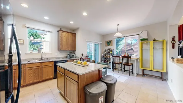 a kitchen with a sink stove and refrigerator
