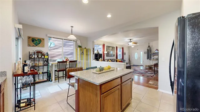 a kitchen with stainless steel appliances granite countertop a refrigerator and a stove